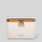 Antique white Hemingway cooler with acacia wood lid, white cushion, and brass hardware.