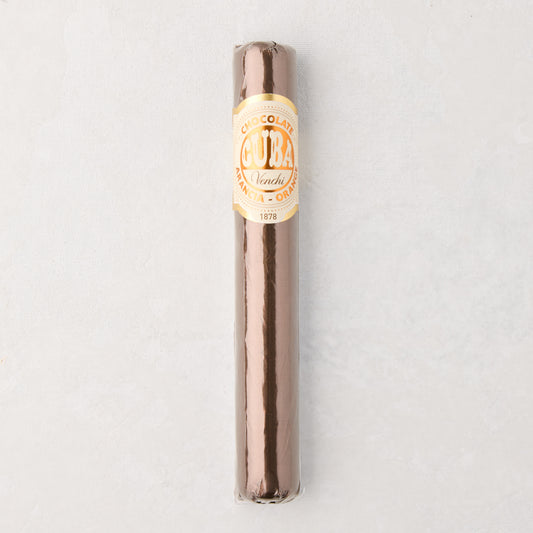 Brown chocolate cigar wrapped in clear plastic with a gold and white "Cuba" label.