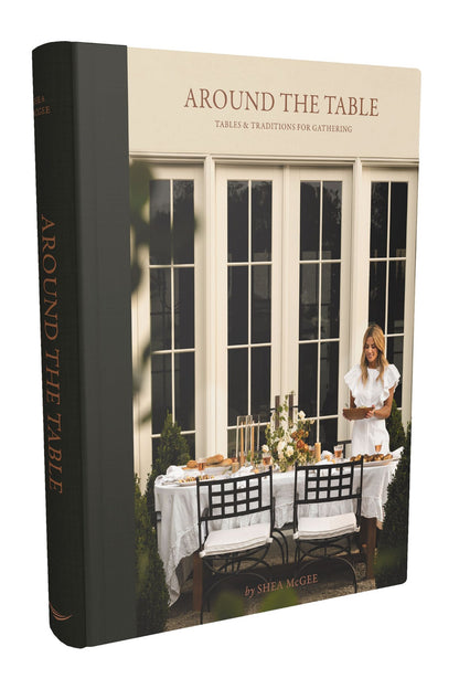 Around the Table hardcover book with a cream cover featuring a woman setting an outdoor dining table.