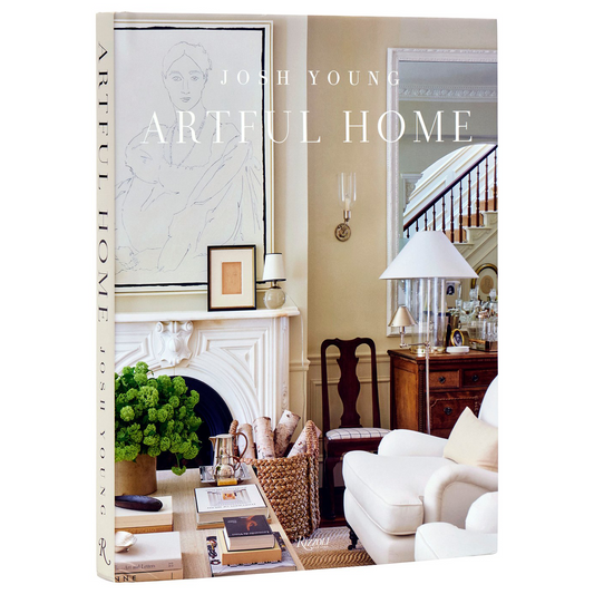 Hardcover "Artful Home" book by Josh Young, featuring a living room scene with white furniture and fireplace.