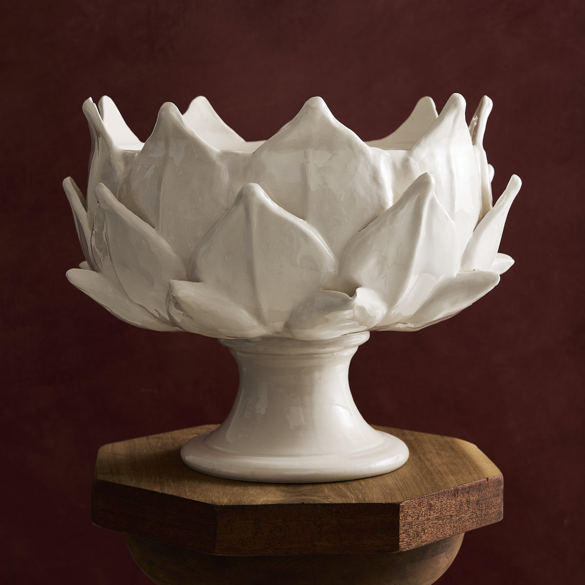 White ceramic artichoke-shaped footed bowl on a wooden pedestal, 14-inch diameter, Italian earthenware.
