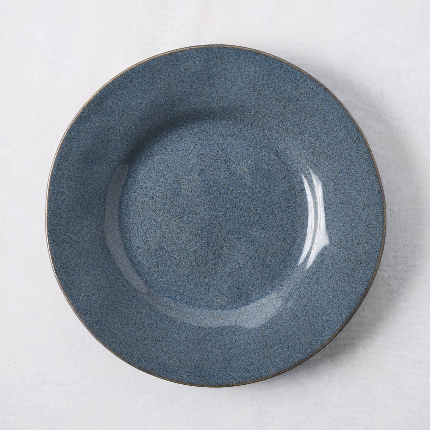 Artisan blue painted stoneware salad plate, 8.78" diameter, with a wide lip and clean edges.