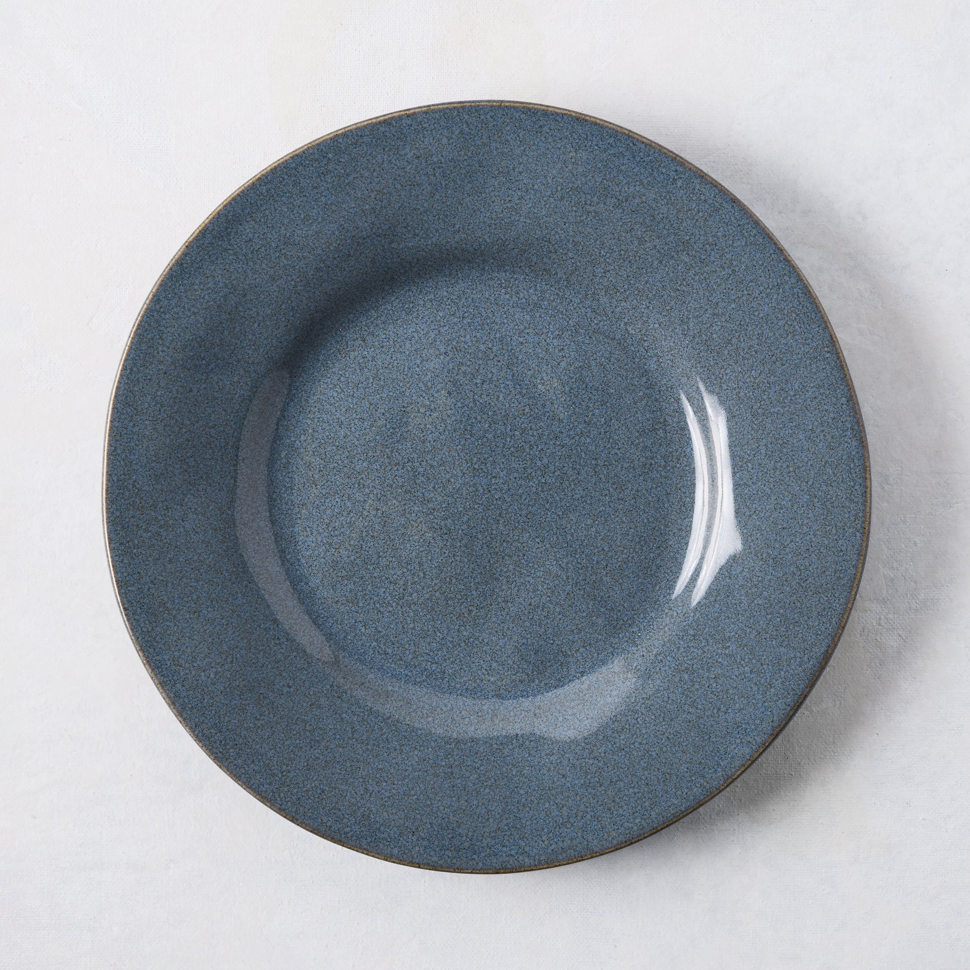 Artisan blue painted stoneware salad plate, 8.78" diameter, with a wide lip and clean edges.