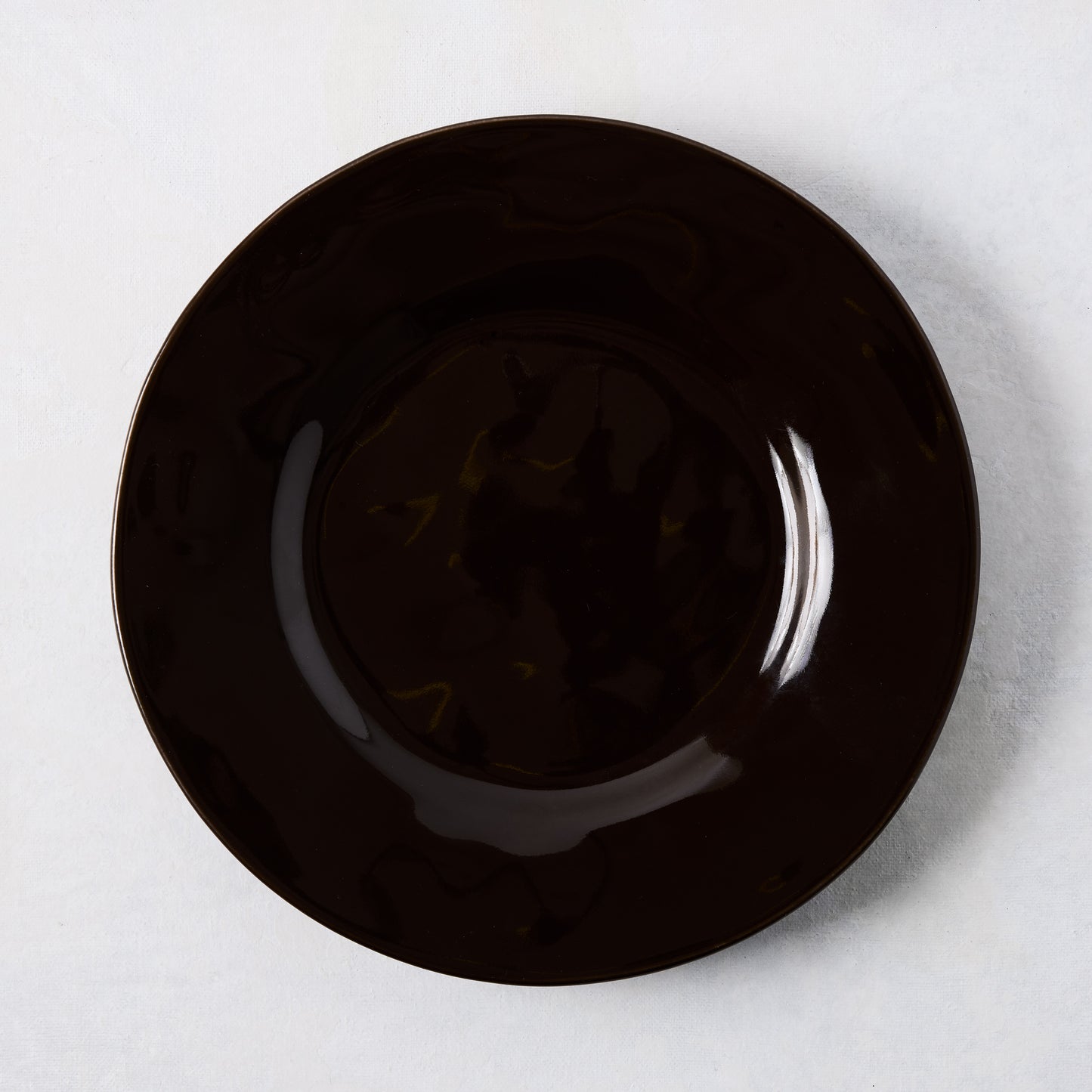 Artisan Chocolate Brown Painted Stoneware Salad Plate, 8.78"Dia, wide lip, clean edges.