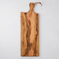 Artisan rectangular olive wood serving board with natural grain and leather cord.