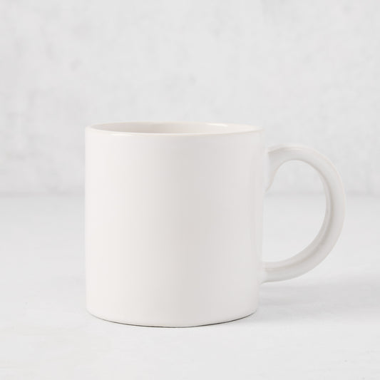 Artisan Stoneware Mug, creamy white glaze, large handle, clean edges.