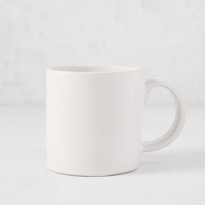 Artisan Stoneware Mug, creamy white glaze, large handle, clean edges.