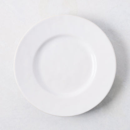 Artisan creamy white stoneware salad plate, 8.27"Dia, with a wide lip.