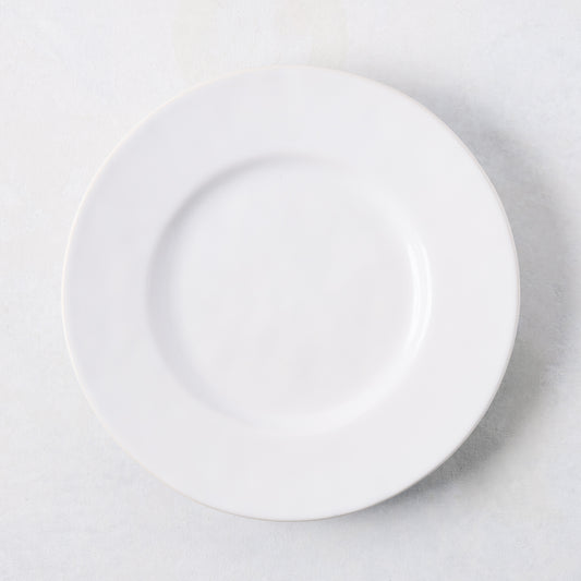Artisan creamy white stoneware salad plate, 8.27"Dia, with a wide lip.