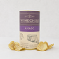 Asiago Wine Chips, 3oz purple and gold cylindrical container with lattice-cut chips scattered around.