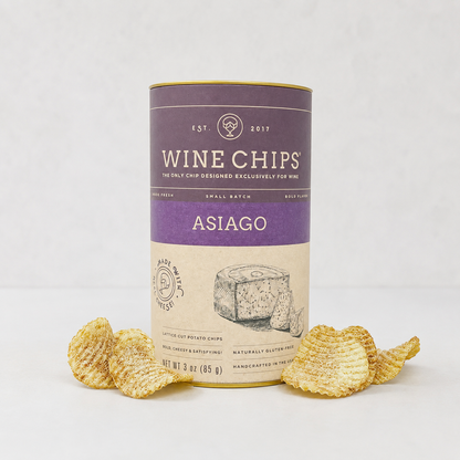 Asiago Wine Chips, 3oz purple and gold cylindrical container with lattice-cut chips scattered around.