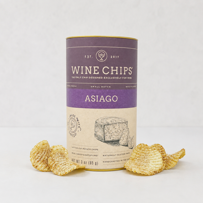 Asiago Wine Chips, 3oz purple and gold cylindrical container with lattice-cut chips scattered around.