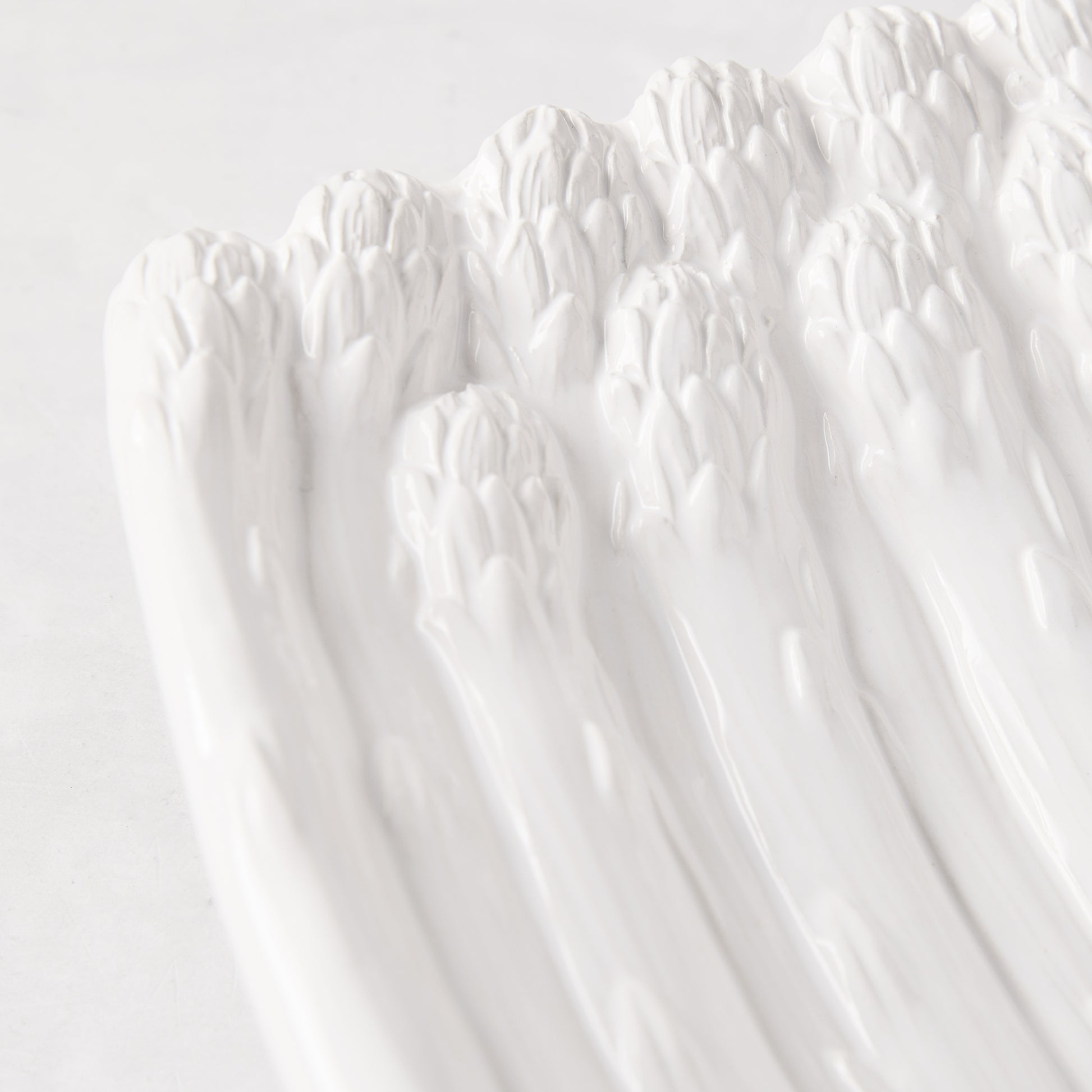 White ceramic serving dish, vintage-inspired asparagus design, 13"L x 9.5"W.