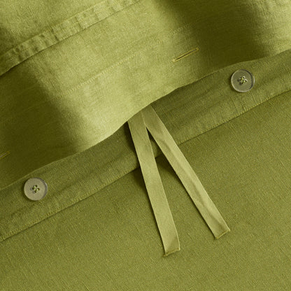 Avocado green washed linen duvet cover with button closures and fabric ties from the Hudson Grace collection.