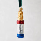 Hand-painted glass baguette ornament with red, white, and blue French flag design, "Baguette" text, and glitter.