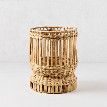Medium Bali Woven Hyacinth Hurricane, natural tan, with glass insert and full-length woven pattern.