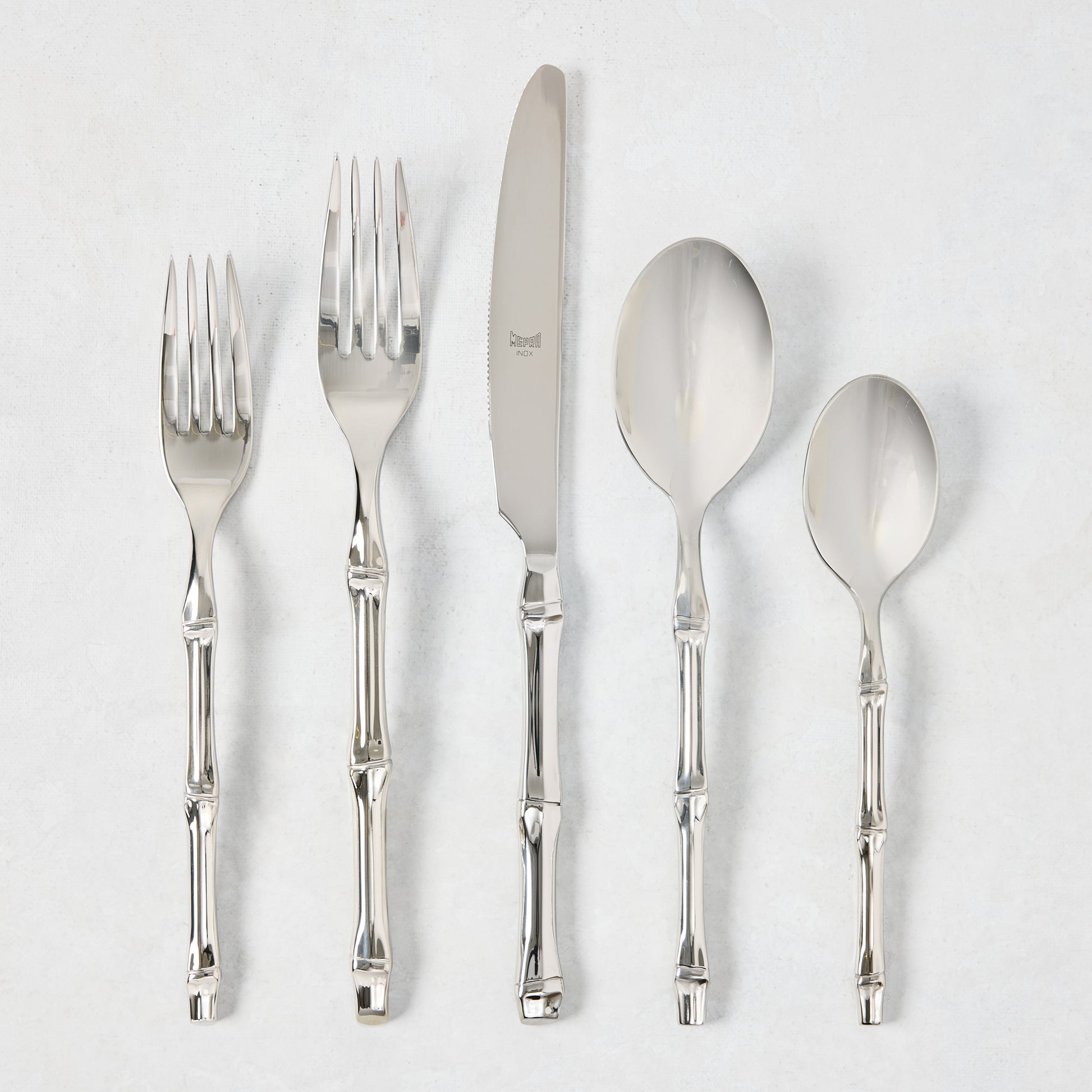 Bali Stainless Steel 5-piece flatware set with bamboo-textured handles.