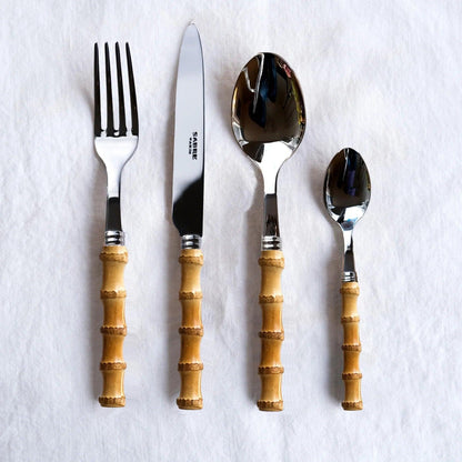 Bamboo 5-piece flatware set with 18/10 stainless steel and natural bamboo handles, including fork, knife, and spoons.