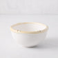 White ceramic nut bowl with a natural-edge, bamboo-inspired rim.