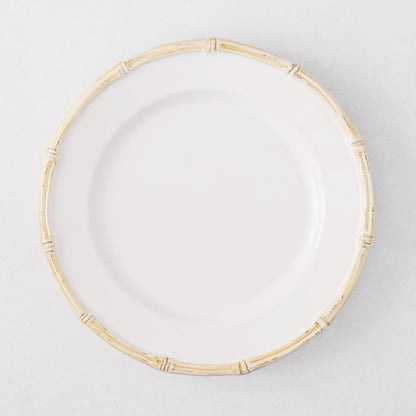 White ceramic salad plate with a natural-edged, bamboo-molded rim.