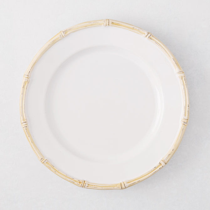 White ceramic salad plate with a natural-edged, bamboo-molded rim.