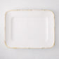 White rectangular ceramic serving platter with a natural-edge bamboo-molded rim.