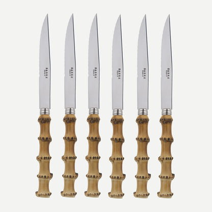Set of 6 bamboo steak knives with stainless steel blades and varnished wood handles.