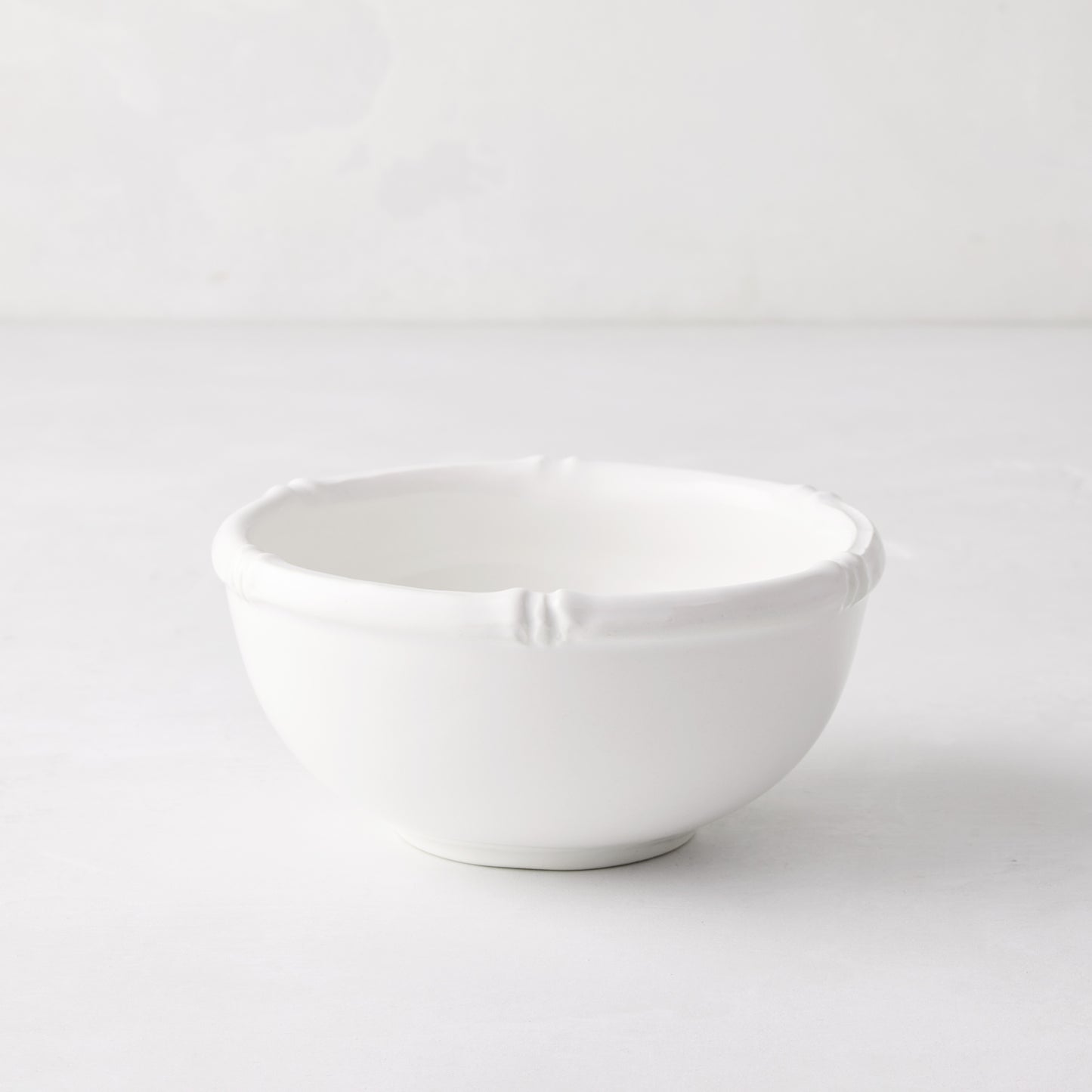 White ceramic nut bowl with molded bamboo detailing, 5" Dia x 2.25" H.
