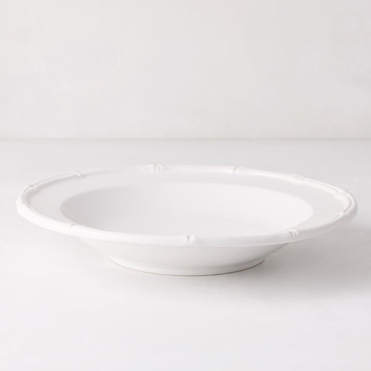 White ceramic soup bowl with molded bamboo detailing, 9.5" diameter.