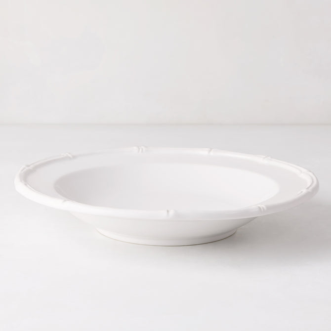 White ceramic soup bowl with molded bamboo detailing, 9.5" diameter.