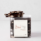 Bark 72 Dark Chocolate Almond Bark, 8oz, in a clear container with pieces stacked on top.
