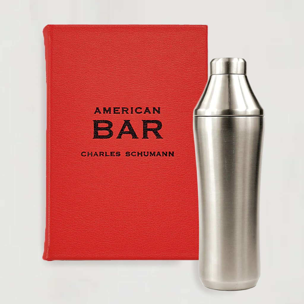 Red cloth-bound "American Bar" book and a silver stainless steel Craft Cocktail Shaker.