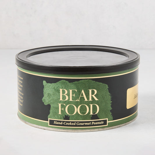 Black cylindrical 22oz tin of Bear Food hand-cooked jalapeno peanuts with green bear logo and gold lettering.