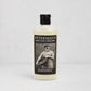 Peterman's 8oz Beeswax Conditioner for Wood Boards & Bowls, light bottle with black label featuring a man.