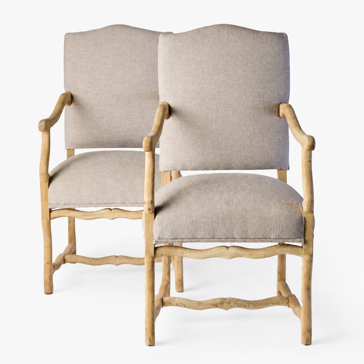 Pair of vintage Belgian armchairs in bleached oak with neutral linen upholstery and rustic hand-hewn wood frames.