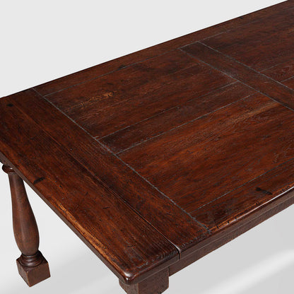 Benedictine extendable oak dining table with mahogany color and vintage patina finish.
