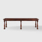 Benedictine extendable oak dining table in mahogany with vintage patina and turned legs.