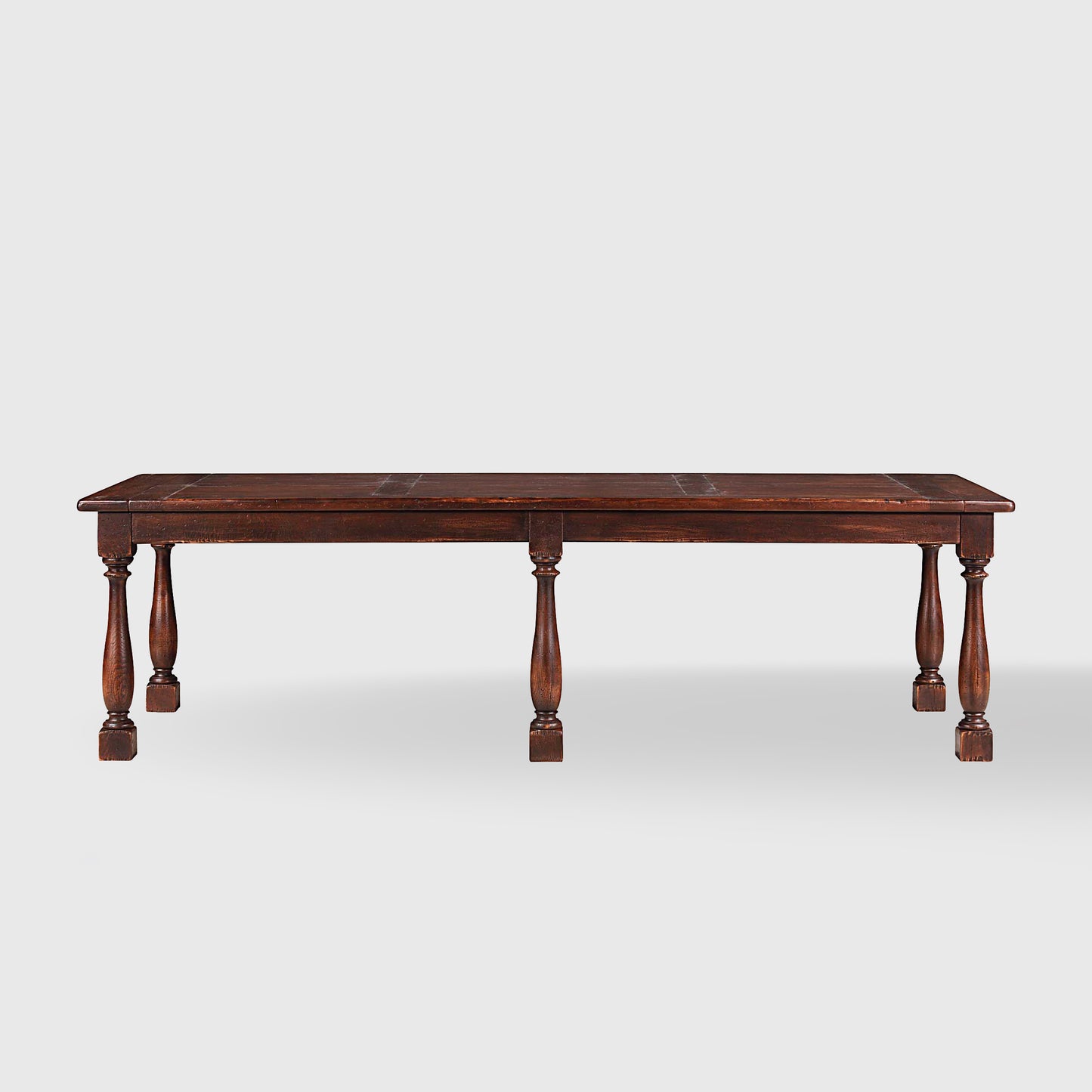 Benedictine extendable oak dining table in mahogany with vintage patina and turned legs.
