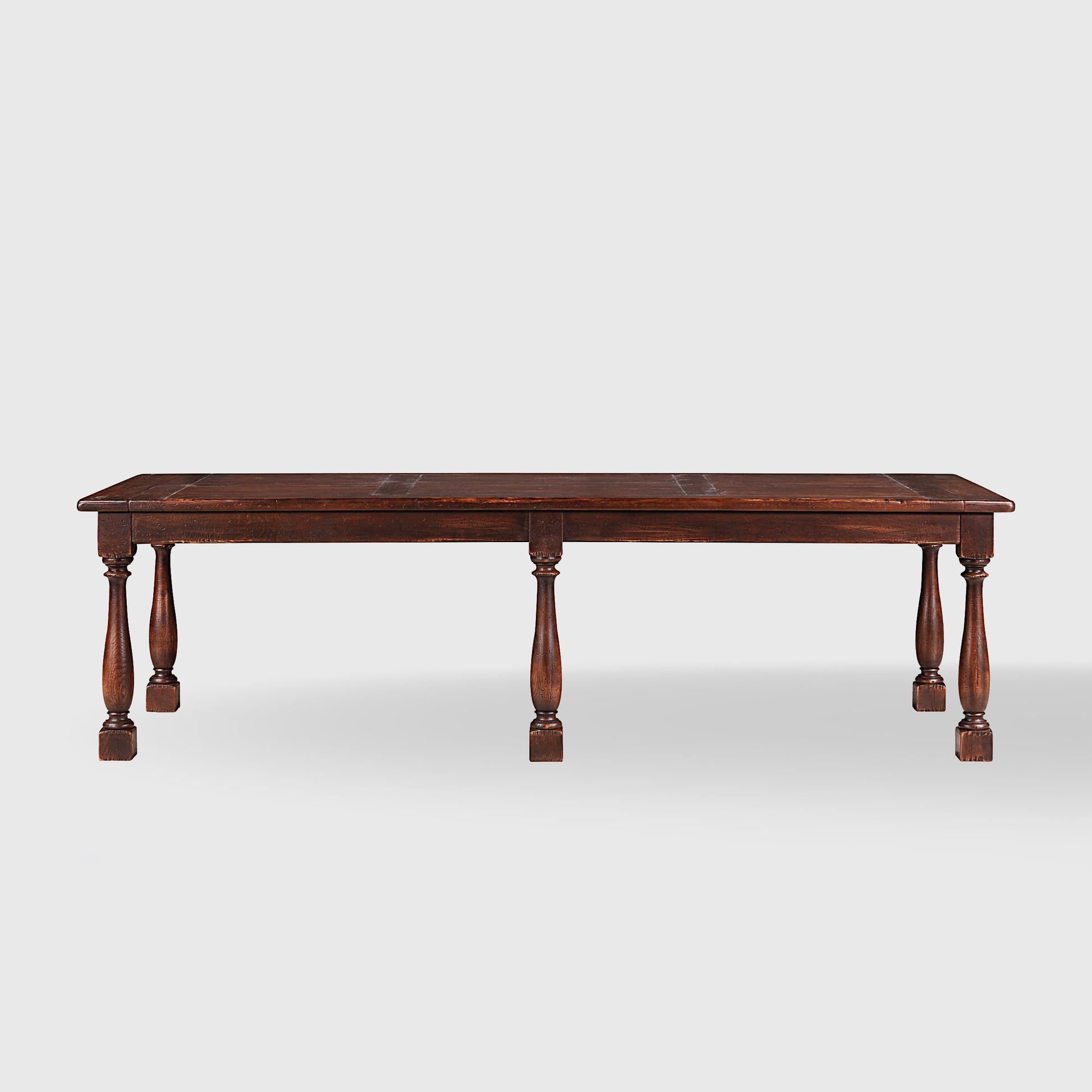 Benedictine extendable oak dining table in mahogany with vintage patina and turned legs.