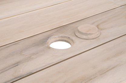Big Sur Dining Table, close-up of light natural teak wood planks with a round umbrella hole and matching plug.