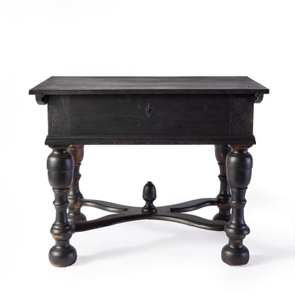 Ebonized black wood console table with carved legs, cross supports, and a central decorative knob.