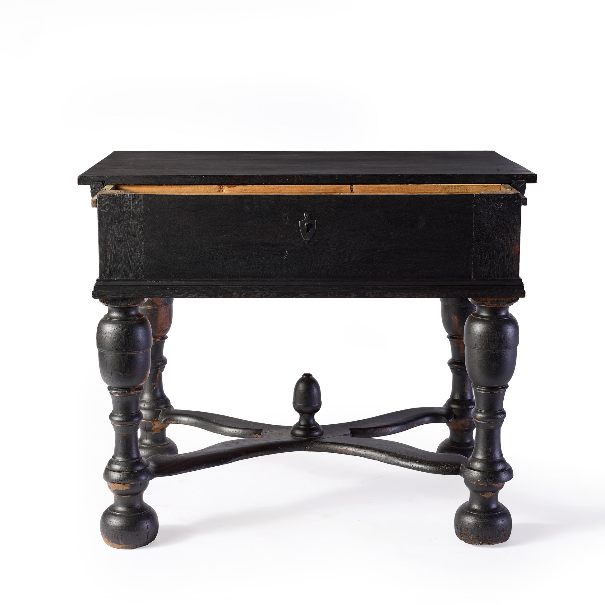 Black ebonized wood console table with carved legs, cross supports, and a central decorative knob.