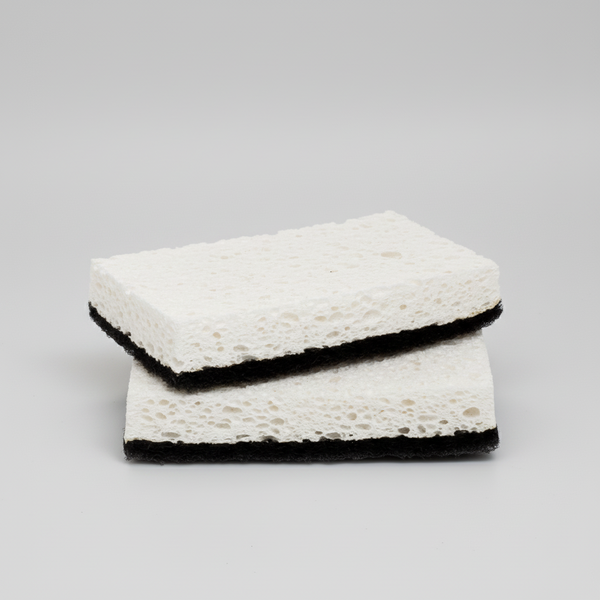 Set of 2 rectangular black and white kitchen scourer sponges with textured white top and black base.
