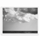 Black and white ocean photograph by Matt Albiani, featuring dark water and dramatic clouds in a white frame.