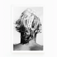 Black and white photograph by Matt Albiani showing the back of a surfer's head with messy, light hair.