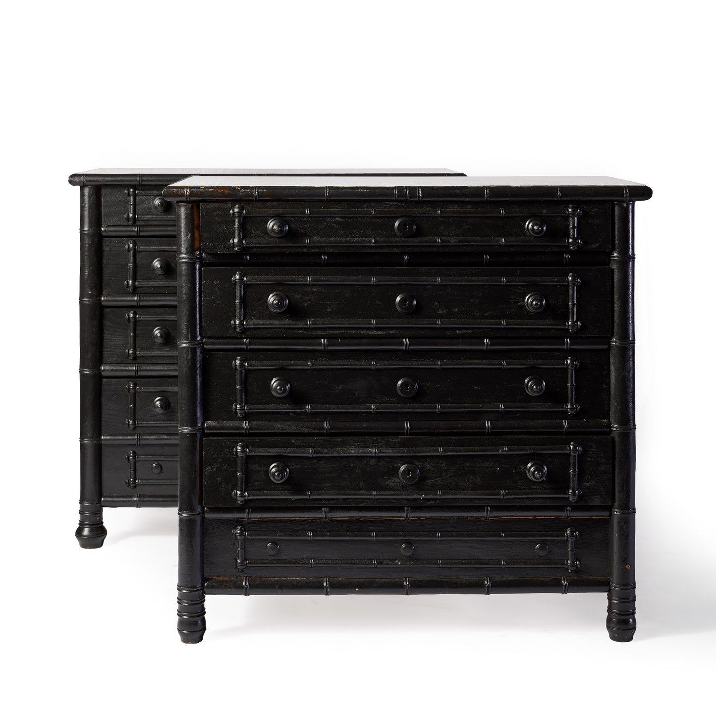 Pair of 1920s Parisian black ebonized dressers with faux bamboo carved detailing and five drawers each.