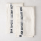 Set of 2 white linen "Bon Appetit" hand towels with black embroidered text and blue striped detail.