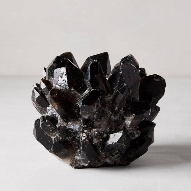 Black genuine quartz crystal votive candle holder, 6.5"Dia x 5.5"H, with raw, unrefined elegance.