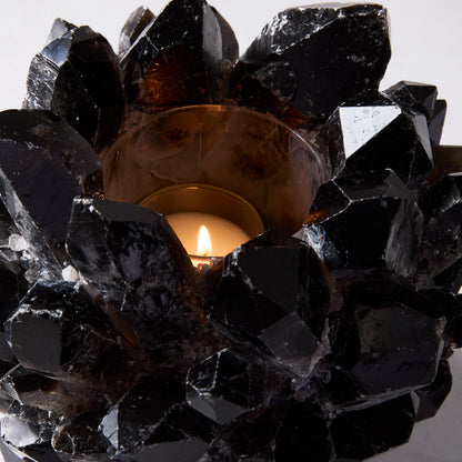 Black Grande Quartz Votive Candle Holder, 9"Dia x 7"H, with a lit candle inside.
