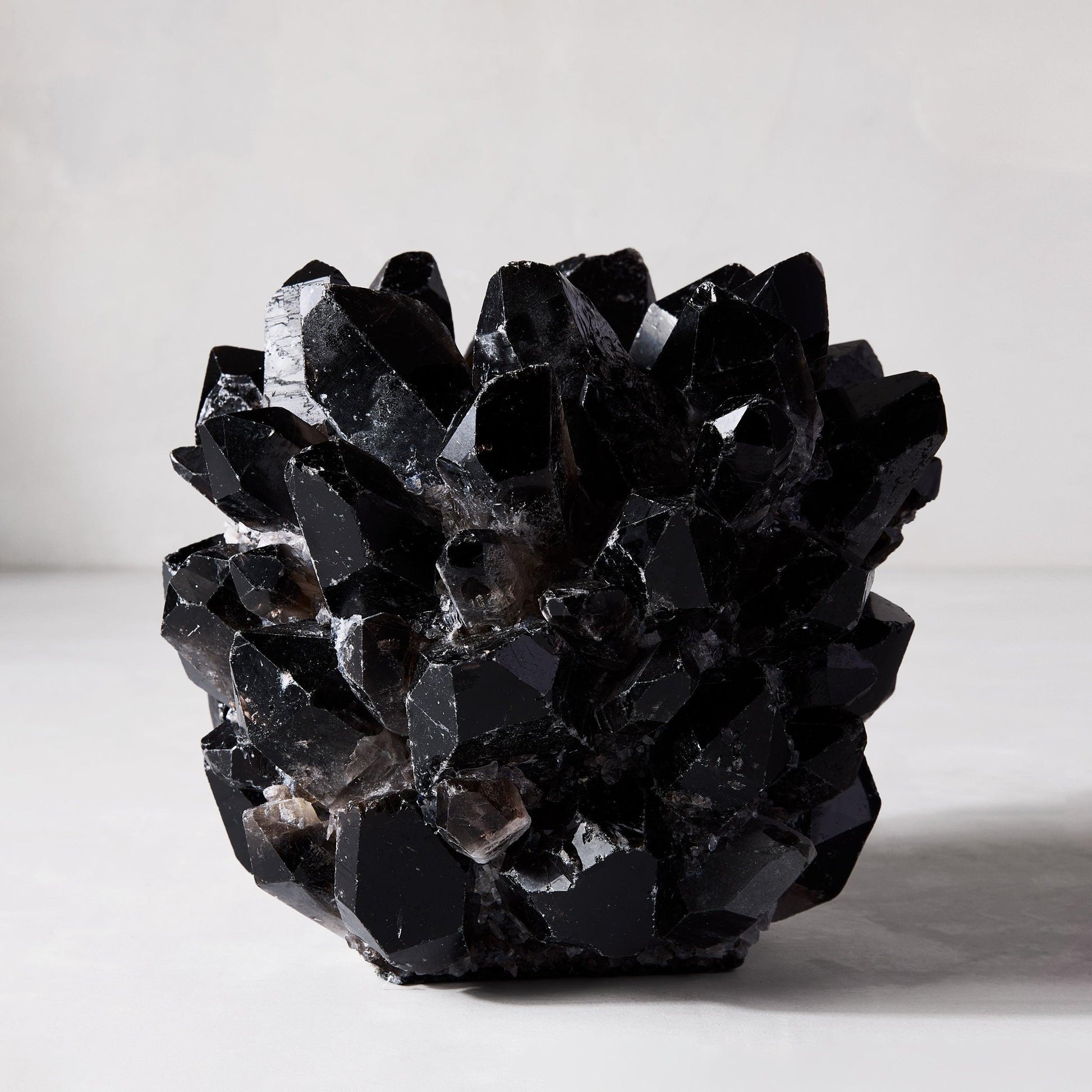 Black Grande Quartz Votive Candle Holder, 9"Dia x 7"H, made of genuine dark quartz crystals.